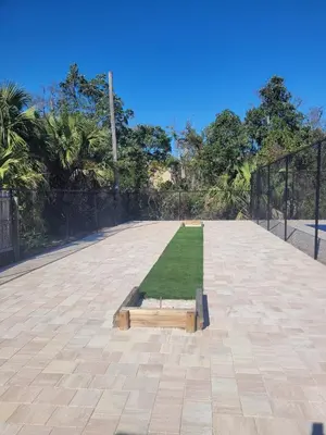 a field of grass in a park with a fence at Southwinds I-5 in Panama City Beach