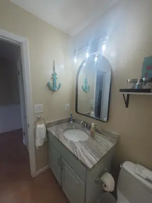a bathroom with a sink and a mirror at Southwinds I-5 in Panama City Beach