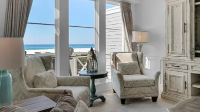 a living room with a view of the beach at 429 S Bridge Ln 107A in Watersound Beach