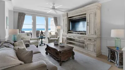 a living room with a couch and a tv at 429 S Bridge Ln 107A in Watersound Beach