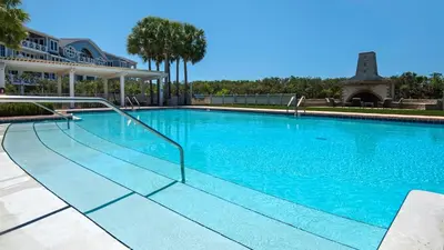 a large swimming pool with blue water at 429 S Bridge Ln 107A in Watersound Beach