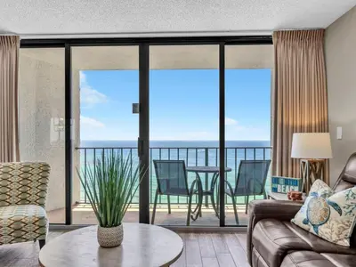 a living room with a couch and a table at Edgewater Tower 3-1110 - South of Heaven in Panama City Beach