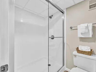 a shower stall in a bathroom with a toilet at Edgewater Tower 3-1110 - South of Heaven in Panama City Beach