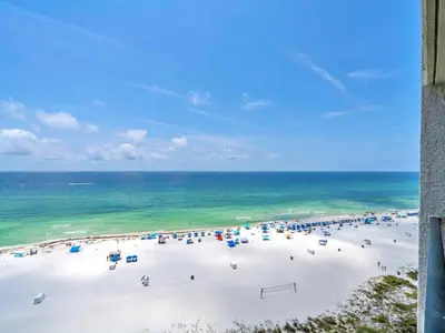 a beach with a lot of umbrellas and the ocean at Edgewater Tower 3-1110 - South of Heaven in Panama City Beach