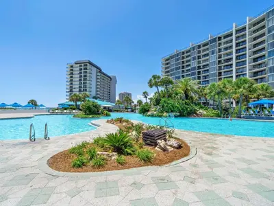 a resort with a large swimming pool with a resort at Edgewater Tower 3-1110 - South of Heaven in Panama City Beach