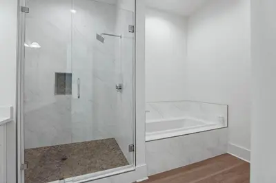 a shower with a glass door in a bathroom at Serenity at Treetop in Inlet Beach