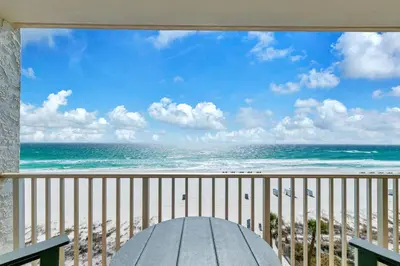 a view of the beach from a balcony at Leeward 403 at Edgewater in Panama City Beach