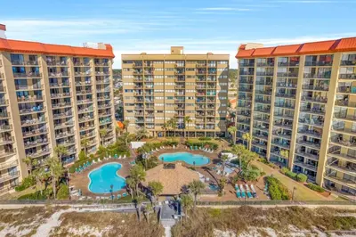 an aerial view of an apartment complex with two pools at East-End PCB Condo with Gulf Views & Beach Access in Panama City Beach
