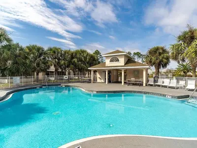 a large swimming pool in front of a building at High Tides by Emerald Coast Retreats in Panama City Beach