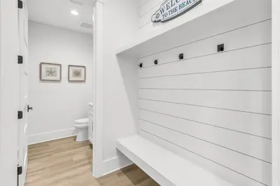 a white bathroom with white walls and a white toilet at Brand New, Private Pool, Walk To Beach, Game Room in Inlet Beach