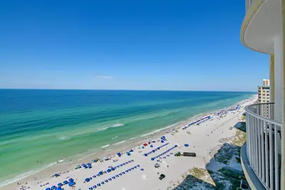 an aerial view of a beach with umbrellas and the ocean at Beachfront Bliss at Ocean Ritz! 3BR 3BA! Sleeps 10 by Dolce Vita Getaways PCB in Panama City Beach