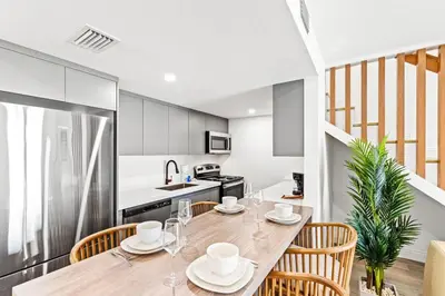 a kitchen and dining room with a table and chairs at Ocean Breeze 1C in Panama City Beach