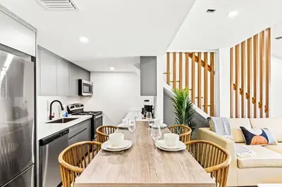 a kitchen and dining room with a table and chairs at Ocean Breeze 2D in Panama City Beach