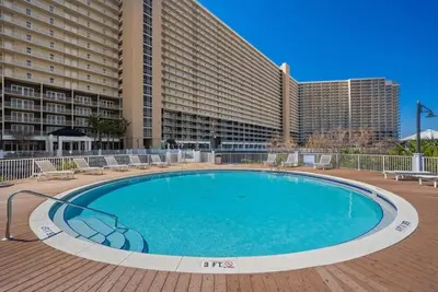 a large swimming pool in front of a building at BeachFrnt 2 Hottub 5 Pools Jet Ski in Panama City Beach