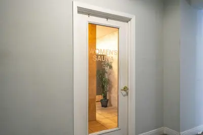 a door leading into a room with a mirror at Pinnacle Port B3-706 in Panama City Beach