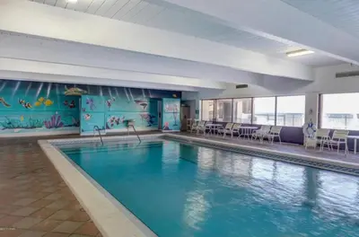 a large swimming pool in a hotel room with a pool at Pinnacle Port B3-706 in Panama City Beach
