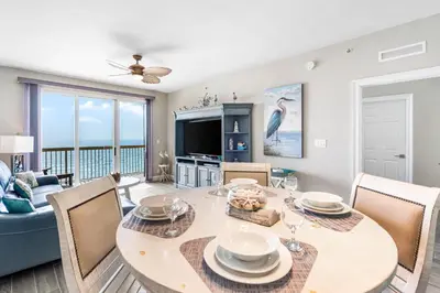a dining room with a table and chairs at Calypso Resort By Sand Seeker Vacations in Panama City Beach