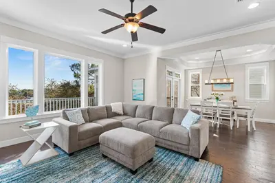 a living room with a couch and a table at Blue Sky Bungalow in Inlet Beach