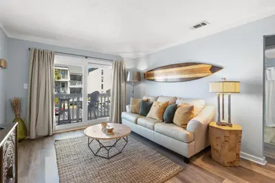 a living room with a couch and a table at Endless Summer A36 - 