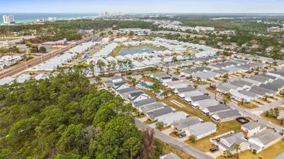 an aerial view of a parking lot with houses at Beach House - Paradise Palace by Panhandle Getaways in Panama City Beach