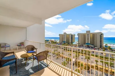 a balcony with a view of the beach and buildings at Laketown Wharf #0722 in Panama City Beach