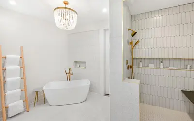a bathroom with a white tub and a sink at Sapphire Bay by Oversee 30A in Santa Rosa Beach