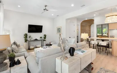a living room with a couch and a table at Sapphire Bay by Oversee 30A in Santa Rosa Beach