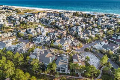 an aerial view of a neighborhood with houses and the ocean at Our Tree House by Oversee 30A in Inlet Beach