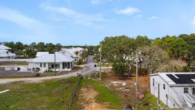 an aerial view of a house and a street at Queen Palm in Inlet Beach