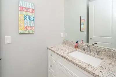 a bathroom with a sink and a mirror at Chic Seagrove Retreat- Modern 30A Coastal Living in Santa Rosa Beach