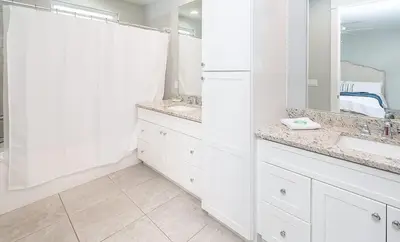 a white bathroom with two sinks and a mirror at Chic Seagrove Retreat- Modern 30A Coastal Living in Santa Rosa Beach