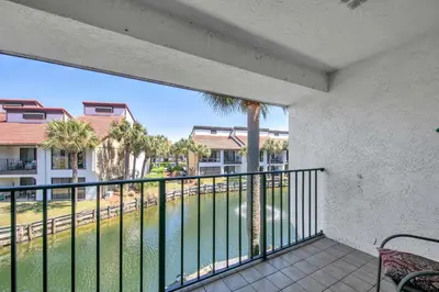 a balcony with a view of a body of water at Edgewater Golf Villa 956 in Santa Rosa Beach