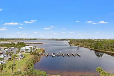 an aerial view of a river with a dock at Pinnacle Port A-506 in Carillon Beach