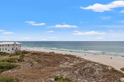 a view of a beach with a building at Pinnacle Port A-506 in Carillon Beach