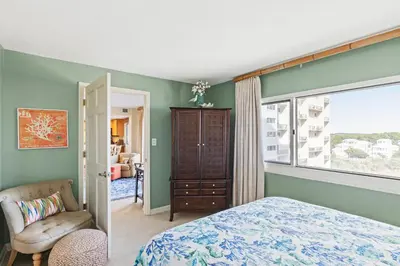 a bedroom with a bed and a window at Pinnacle Port A-514 in Carillon Beach