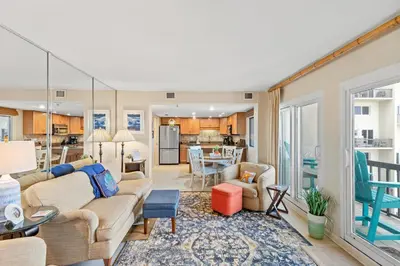 a living room with a couch and a table at Pinnacle Port A-514 in Carillon Beach