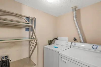 a laundry room with a washer and dryer at Pinnacle Port A-730 in Carillon Beach