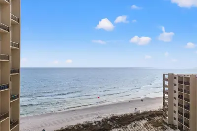 a view of the beach from the balcony of a building at Pinnacle Port A-730 in Carillon Beach