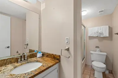 a bathroom with a sink and a toilet at Pinnacle Port A-730 in Carillon Beach