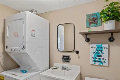 a bathroom with a sink and a mirror at Pinnacle Port, A-708 in Carillon Beach
