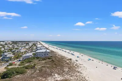 an aerial view of a beach with people and the ocean at Pinnacle Port Penthouse11 in Carillon Beach