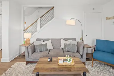 a living room with a couch and a table at Pinnacle Port Penthouse 15 in Carillon Beach