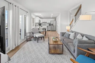 a living room with a couch and a table at Pinnacle Port Penthouse 15 in Carillon Beach