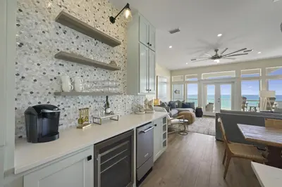 a kitchen with a dining room and a living room at Rays on 30A in Santa Rosa Beach