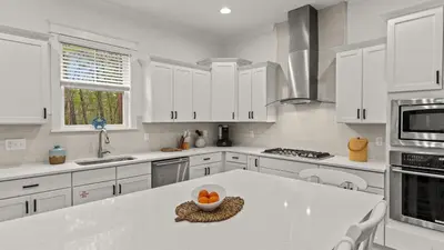 a kitchen with white cabinets and a white counter top at Near Inlet Beach AccessLake Powell Pool Patio Lounge GDay 30A by AvantStay in Inlet Beach