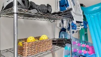 a metal wire shelf with a basket of lemons at The Bee's Knees in Santa Rosa Beach