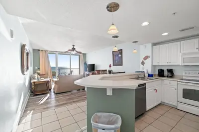 a kitchen with white cabinets and a counter top at Majestic Beach Resort Tower 2 Unit 2207 in Panama City Beach