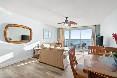 a living room with a couch and a table at Majestic Beach Resort Tower 2 Unit 2207 in Panama City Beach
