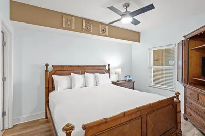 a bedroom with a bed and a ceiling fan at Majestic Beach Resort Tower 2 Unit 2207 in Panama City Beach