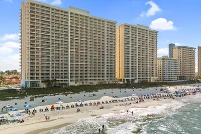 a group of people on the beach in front of a building at Majestic Beach Resort Tower 2 Unit 2207 in Panama City Beach